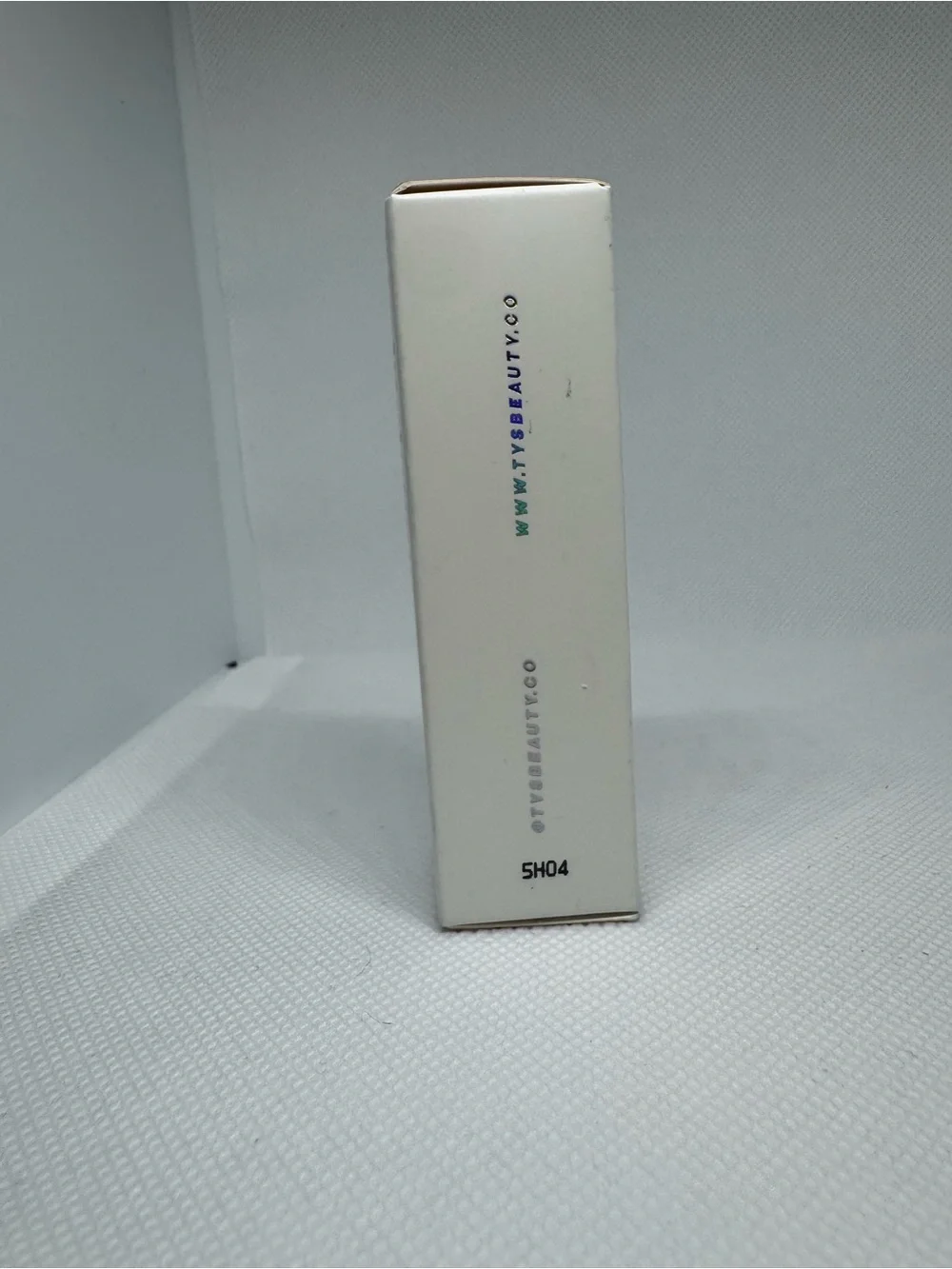 Dew Stick Highlighter — Champagne Glow (Peachy Beige)